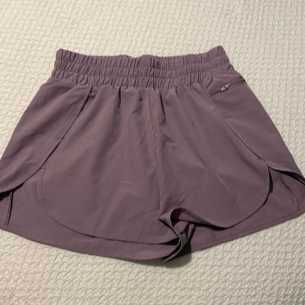 Women’s medium purple athletic shorts.